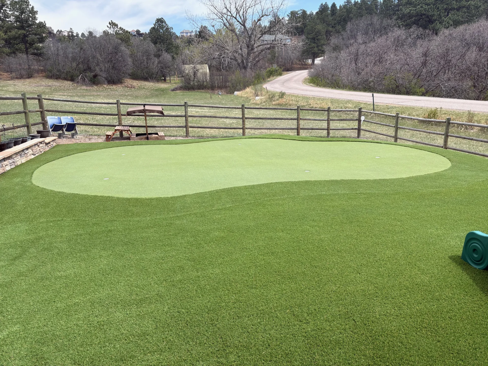 Finished backyard putting green with Colorado mountain views